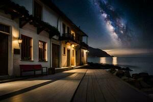 ein Haus mit ein Balkon mit Blick auf das Ozean und Sterne. KI-generiert foto