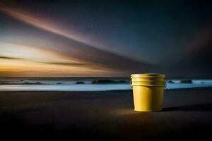 ein Gelb Eimer sitzt auf das Strand beim Sonnenuntergang. KI-generiert foto