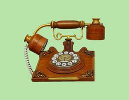 Jahrgang Telefon, hölzern Telefon isoliert auf Grün Pastell- Farbe Hintergrund mit Ausschnitt Weg. Kommunikation und alt Technologie im retro Stil. diese Objekt gemacht durch Holz mit ein Neugestaltung Konzept foto