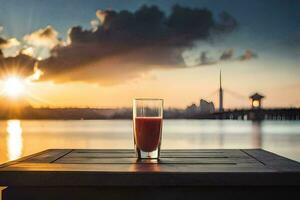 ein Glas von Saft auf ein Tabelle im Vorderseite von das Sonnenuntergang. KI-generiert foto