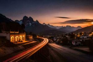 ein Sonnenuntergang Über ein Berg Stadt, Dorf mit ein Straße und Beleuchtung. KI-generiert foto