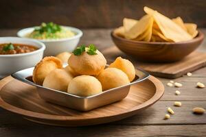 indisch Essen mit Chips und Dips auf hölzern Tisch. KI-generiert foto