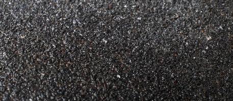 Textur der dunkelgrauen Sandpapier-Asphaltfarbe