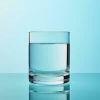 ai generiert ein Glas von sauber Trinken Wasser auf ein Licht Blau Hintergrund foto
