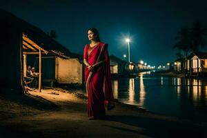 ein Frau im ein rot Sari steht auf das Seite von ein Fluss beim Nacht. KI-generiert foto