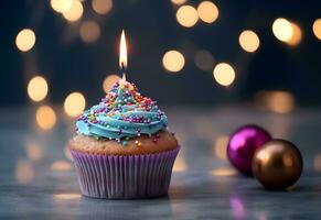 Geburtstag Cupcake mit ein Kerze und festlich Lametta Dekoration auf ein Blau Hintergrund mit Kopieren Raum. generiert ai. foto