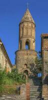 alt Stein Turm mit ein orthodox kreuzen, Georgia foto