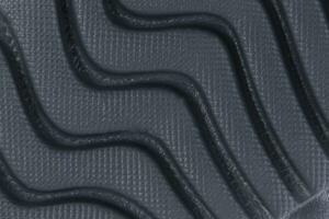 Fragment von ein Gummi schwarz Sohle, einzig, alleinig Sneaker. Unterseite von Sport Schuhe foto