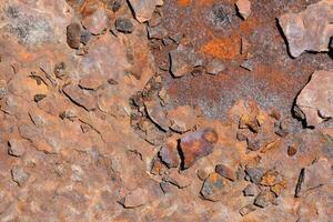 ein schließen oben von ein rostig Metall Mauer foto