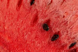 saftig lecker Wassermelone mit rot Textur und Knochen, Nahansicht. Sommer- Hintergrund foto