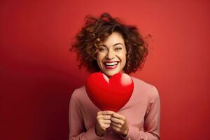 Porträt von ein glücklich Frau mit rot Herz auf ein rot Hintergrund.Valentinstag Tag Konzept ai generiert foto