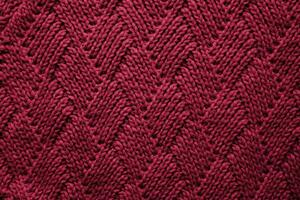 gestrickt wolle Textur farbig im das Farbe von das Jahr 2023 viva Magenta 18-1750. Hintergrund. Banner. Nahansicht. selektiv Fokus. foto