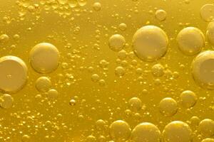 Öl Blase Textur auf Gold Hintergrund. foto