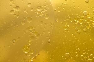 Öl Blase Textur auf Gold Hintergrund. foto