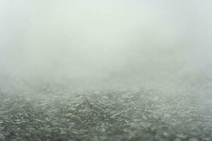 Kies Textur Fußboden mit Nebel oder Nebel. Licht, dunkel und grau abstrakt Kies Textur zum Anzeige Produkte foto