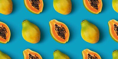 Papaya Obst nahtlos Muster auf Blau Farbe Hintergrund foto