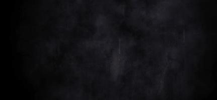 dunkler Schmutzzementhintergrund mit Kratzern, dunkle Wandbeschaffenheit des Horrors foto