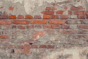 alter Backsteinmauerhintergrund aus Ziegelsteinen Wandoberflächenstruktur foto