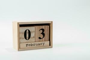 hölzern Kalender Februar 03 auf ein Weiß Hintergrund foto