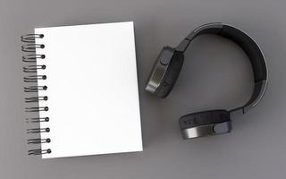 ein Buch mit Kopfhörern in einem grauen Raum. foto