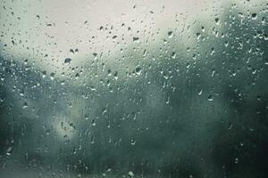 Regen Tropfen auf ein Fenster mit verschwommen Hintergrund foto