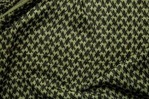 keffieh Schal. das Textur von das Baumwolle traditionell symbolisch arabisch Schal. khaki zurück. foto