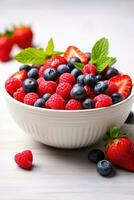 ai generiert ein bunt Schüssel von frisch Frucht, einschließlich Erdbeeren, Blaubeeren, und Himbeeren, vereinbart worden foto