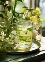 ai generiert Grün Tee mit Blumen auf ein Tabelle foto