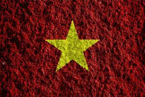Flagge von sozialistisch Republik von Vietnam auf ein texturiert Hintergrund. Konzept Collage. foto