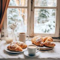 ai generiert gemütlich Wochenende Stimmung mit dämpfen Kaffee, Croissants, und ein schneebedeckt Fenster Hintergrund foto