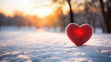 ai generiert Single rot Herz im schneebedeckt Landschaft beim Sonnenuntergang foto