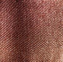 ai generiert ein sehr schließen oben Foto von ein Stoff Textur mit rot und braun Farbe Töne,