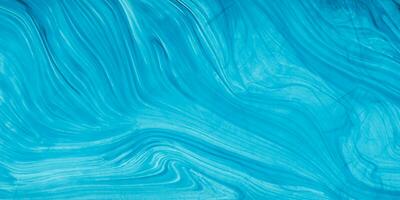 blauer abstrakter Hintergrund mit Wellenlinien foto