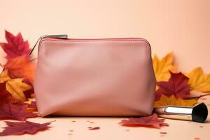 ai generiert Rosa Leder Kupplung mit bilden Bürsten und Herbst Blätter auf Beige Hintergrund, Herbst Schönheit Hintergrund, kosmetisch Tasche mit bilden Schönheit Produkte und Herbst Blätter beim Pastell- Hintergrund foto