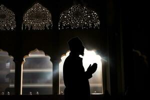 ai generiert Silhouette Muslim Mann beten n das Moschee foto
