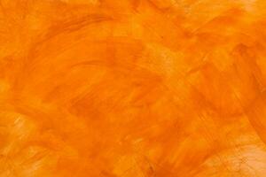 texturiert Mauer gebürstet gemalt Hintergrund, abstrakt Orange Öl Farbe. foto