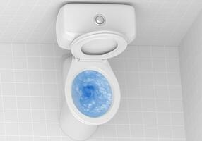 Blick von oben auf die Toilettenschüssel, darin spült blaues Spülmittel foto