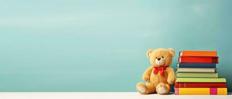 ai generiert horizontal Banner, International Kinder Buch Tag, ein Stapel von Bücher und ein Teddy Bär auf ein Blau Hintergrund, ein Platz zum Text foto