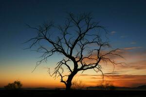 ai generiert Sonnenuntergang Einsamkeit Silhouette von ein trocken Baum gegen das Dämmerung foto