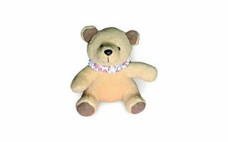 ein ausgestopft Teddy Bär mit ein Rosa Halsband foto