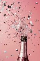 ai generiert Champagner Flasche fallen auf ein Rosa Hintergrund foto