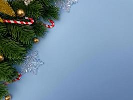 Weihnachtsschmuck, Kiefernblätter, goldene Kugeln, Schneeflocken, goldene Beeren auf blauem Hintergrund foto
