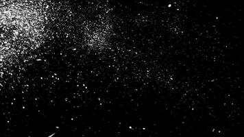 abstrakt Weiß Staub Partikel schwebend auf schwarz Hintergrund, einfarbig. Animation. Weiß dynamisch Bewegung von abstrakt Schnee. foto