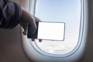 Hand berühren nehmen ein Foto mit Handy, Mobiltelefon Telefon auf neben Fenster