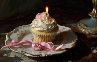 ai generiert winzig Cupcake mit Kerze und Rosa Band foto