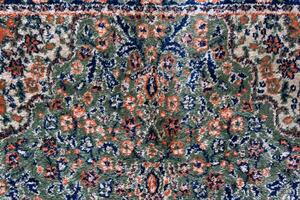 schließen oben Texturen Hintergrund und Muster im Farbe von gewebte Teppiche. traditionell wolle Türkisch Teppich. handgemacht und dekorativ. foto