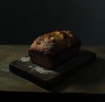 ai generiert Laib von Brot auf ein hölzern Tafel foto