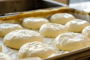 ai generiert roh Hefe Teig Bälle im Tablett Vor Backen. Konzept Zuhause Backen Brot. generativ ai foto