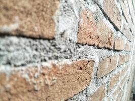 rot Farbe Backstein Mauer zum Mauerwerk Hintergrund Design. schließen oben foto