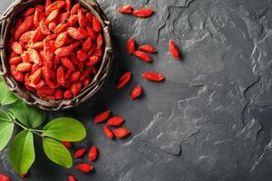 ai generiert frisch Goji Beeren auf dunkel Rau Stein Tisch. foto